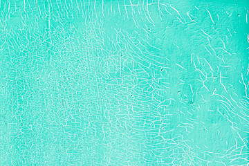 Cracks texture. Mint color background. Blue background.