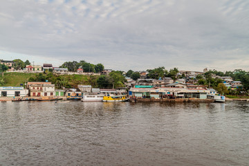Fototapeta na wymiar SANTO ANTONIO DE ICA, BRAZIL - JUNE 23, 2015: View of a pier at the river port pier of Santo Antonio de Ica town, Brazil.