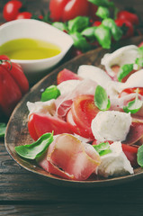 Italian salad caprese with ham and mozzarella