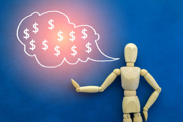 money concept with wooden figure and speech bubble