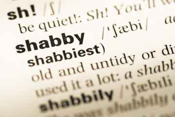 Obraz premium Close up of old English dictionary page with word shabby