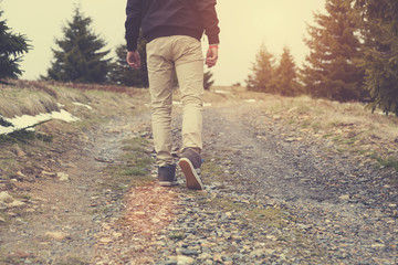 Fototapeta premium Man walking through the nature. 