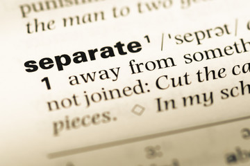 Close up of old English dictionary page with word separate