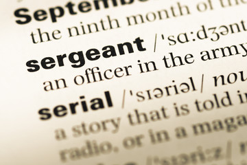 Obraz premium Close up of old English dictionary page with word sergeant