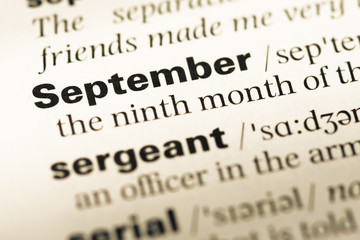 Obraz premium Close up of old English dictionary page with word september
