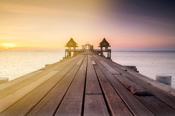old wood bridge pier with sunset