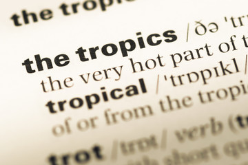 Obraz premium Close up of old English dictionary page with word the tropics
