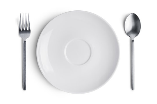 A white plate with silver fork and spoon