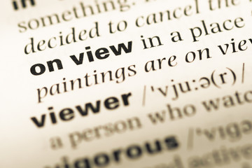 Obraz premium Close up of old English dictionary page with word on view