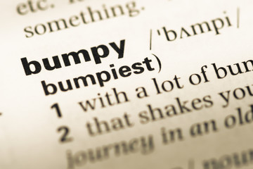 Close up of old English dictionary page with word bumpy