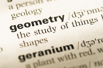 Close up of old English dictionary page with word geometry