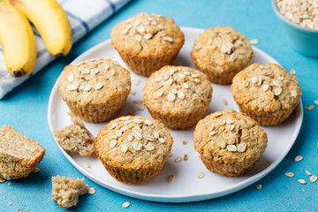 Healthy vegan oat muffins, apple and banana cakes with sour cream on a white plate
