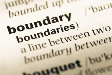 Fototapeta premium Close up of old English dictionary page with word boundary