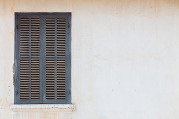 Fototapeta premium old dirty window on old dirty wall,Luang Prabang, Laos