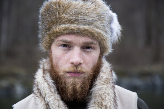 Mid adult man wearing trapper hat, portrait
