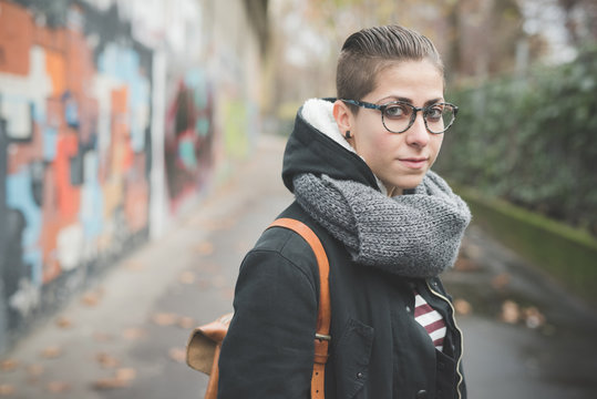 Teenager On Street, Graffiti Wall In Background