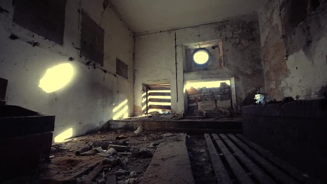 Abandoned building interior. Dolly camera. Smooth motion.