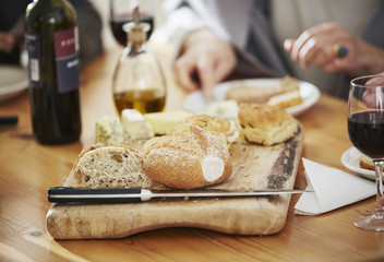 Freshly baked bread on breadboard, close up