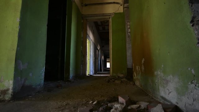 Abandoned building interior. Dolly camera. Smooth motion.