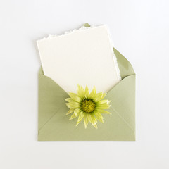 Empty cardboard card with flower and an envelope