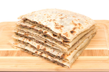 stack tortillas stuffed with meat