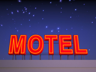 Neon motel sign with a night sky.