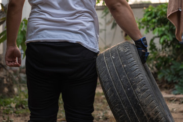Man hold tire for exercise