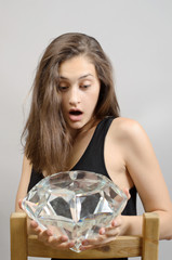 Beauty girl Portrait with a huge diamont, brilliant