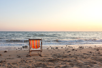 Beach chair with sunset