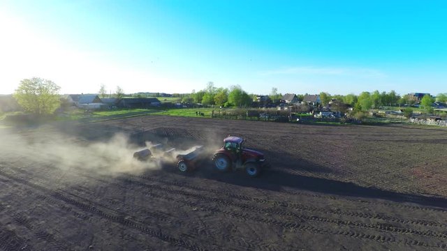 Agriculture, Tractor Working On A Field. Aerial footage.