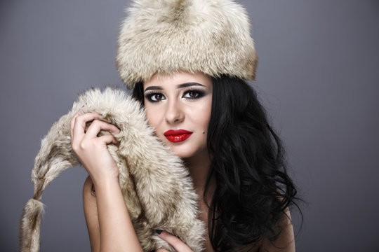 Fur Fashion. Beautiful Girl in Fur Hat. Winter Woman Portrait