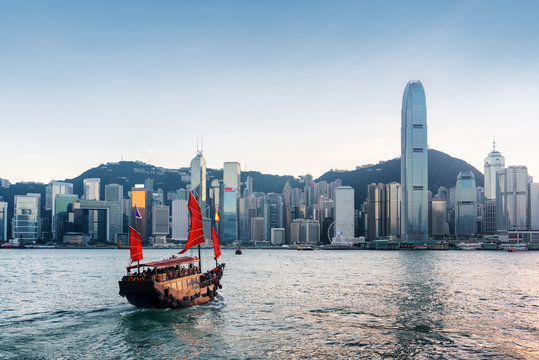 Tourist sailboat crosses Victoria harbor in Hong Kong