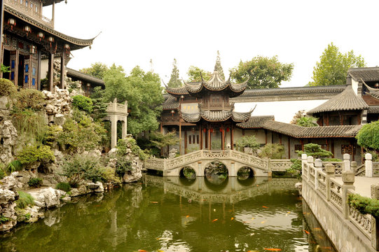 Traditional Chinese garden with fish pool, stone bridge and pavilions, Hangzhou, China