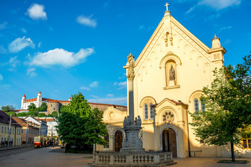 Fototapeta na wymiar Capuchin church with castle hill on the background in Bratislava city in Slovakia
