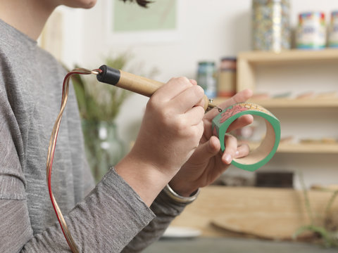 Close up of artist working on jewellery piece