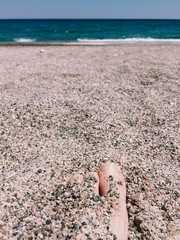 toes buried in the sand