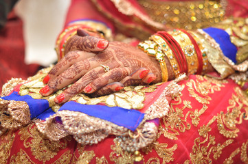 Bridal henna covered hands of an Indian Bride