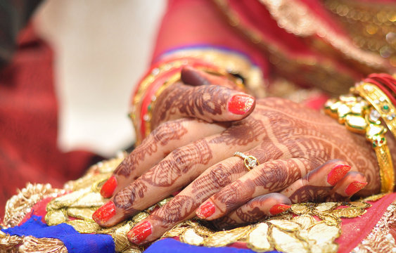 Bridal henna covered hands of an Indian Bride