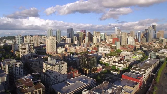 Aerial Pan of Amazing Cityscape with Downtown City Buildings with Blue Sky and Scattered Clouds