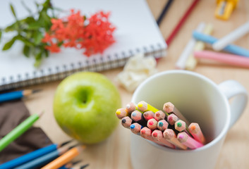 crayon in white cup. (Back to school concept)