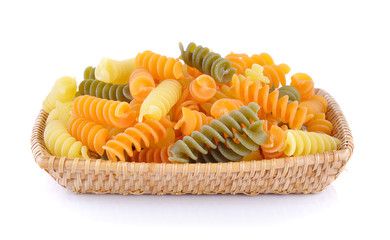Pasta in basket on white background
