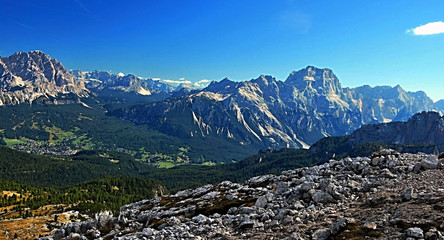 Fototapeta na wymiar mountain valley with Cortina d'Ampezzo resort and high mountain peaks around in Dolomites