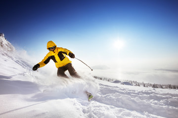 Skier rides on the slope. Sheregesh resort, Siberia, Russia. Space for text