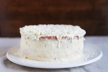Hazelnut and white chocolate layered cake with crumbled chocolate