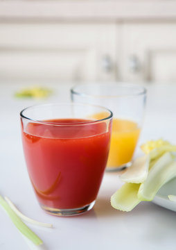 Glasses with juice and celery