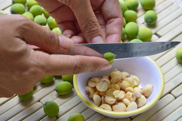 hand peel out lotus seed by kitchen knife