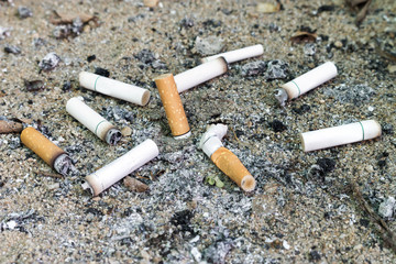 Cigarettes butt in ashtray [blur and select focus background]