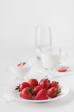 Strawberries on a plate and milk