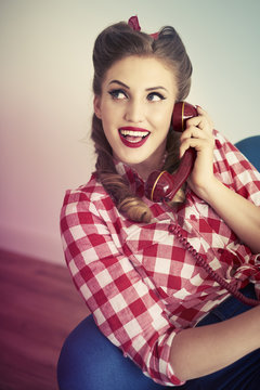 Pin up girl talking on the phone
