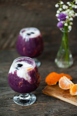 Yogurt with blueberry sauce and oranges